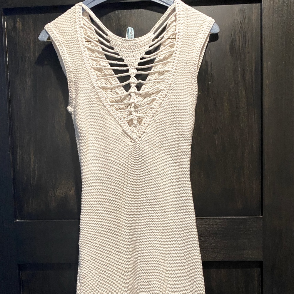 This is a knit Guess Dress in white and small